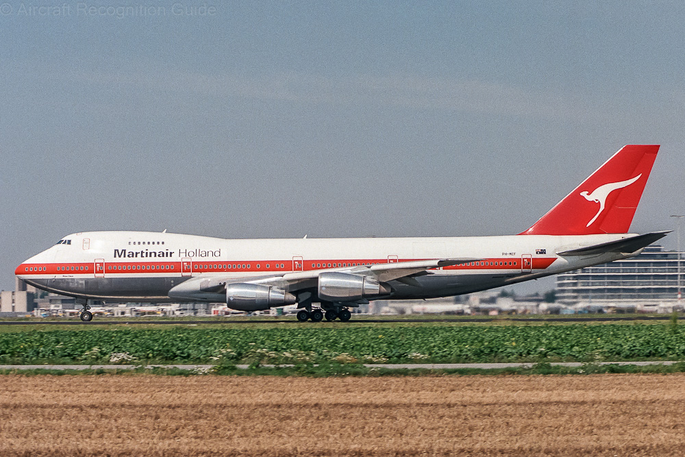 This Boeing 747-200C has two large cargo doors, one in the nose and one in the left rear fuselage. It retains the cabin windows and doors. Image