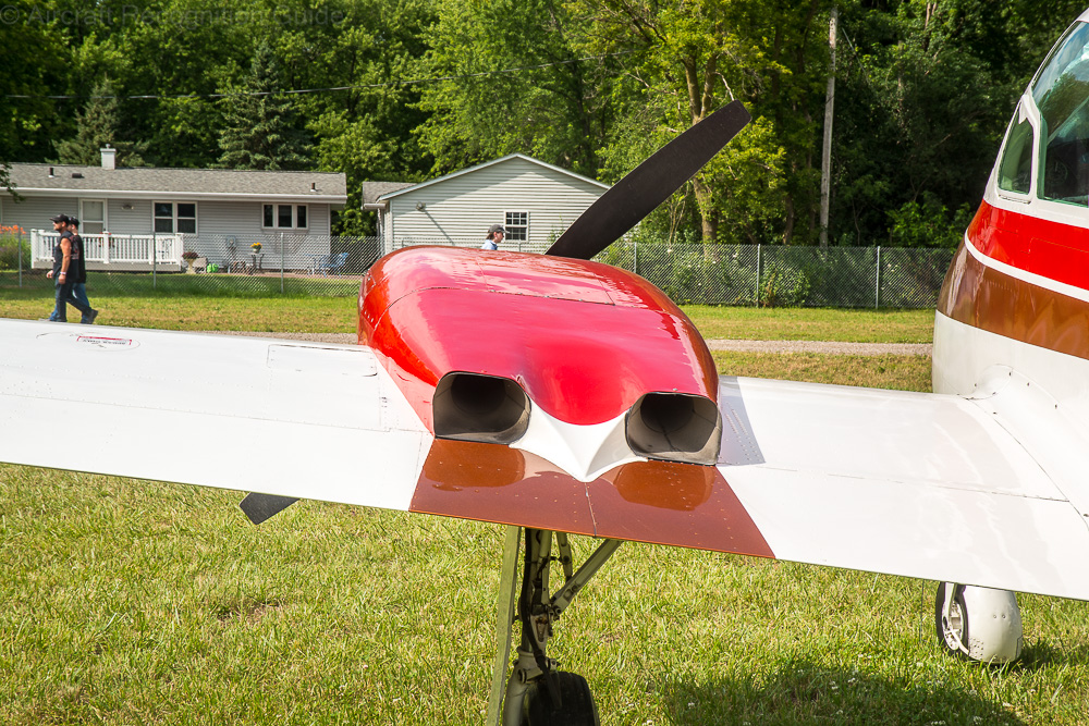 Early Cessna 310's engines had double, long exhausts with augmenter tubes on top of the wings. Image