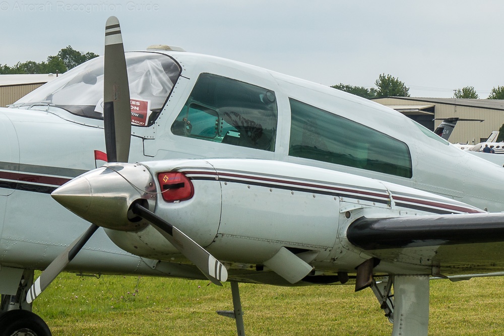The open flap at the side of the nacelle is a key feature of the Cessna T310R, and other turbocharged 310 models. Note the vertical exhaust pipe behind. Image