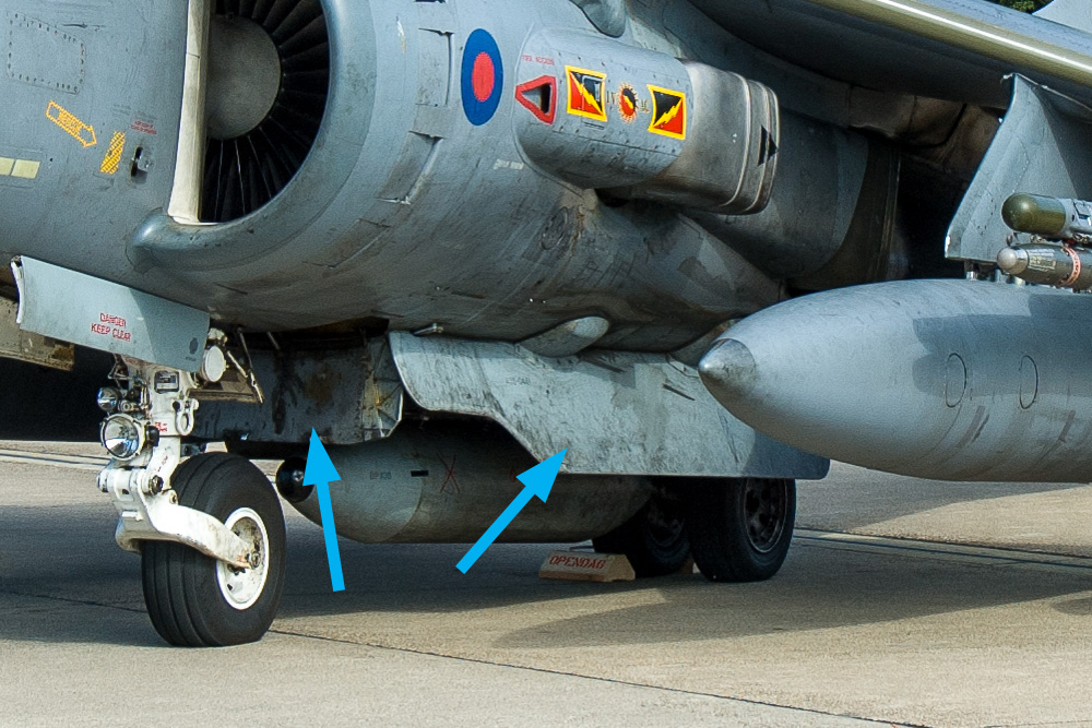 The flaps marked on the photo are lift improvement devices of the Harrier II, or LIDs. They trap the exhaust flows that bounce on the ground. Image