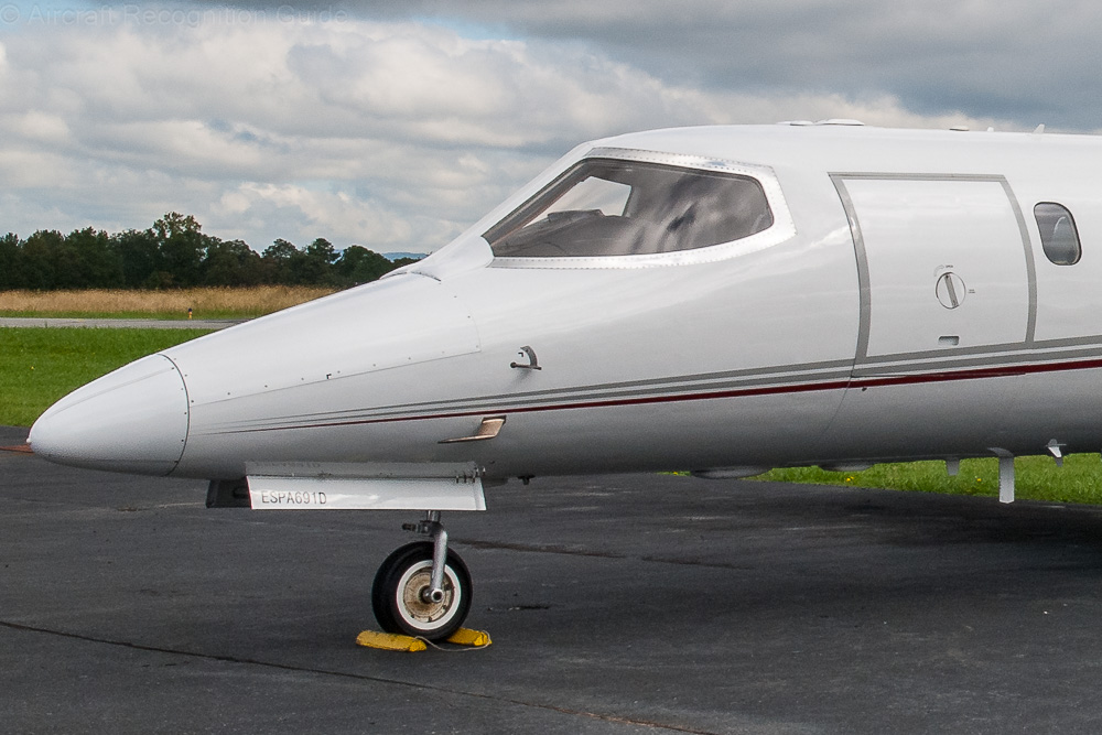 The two-piece cockpit windows that are signature to most of the Learjets. While some models have four cockpit windows, they retain the basic curved shape. Image
