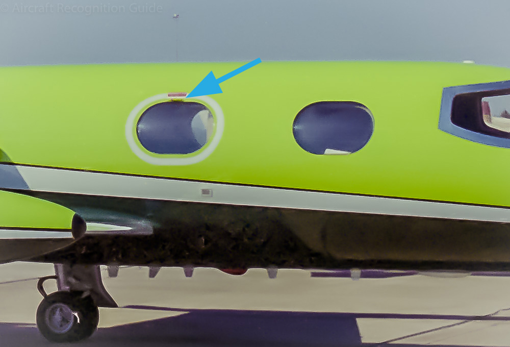If you look closely you can see that the Learjet 24 has an externally visible handle at the top edge of the aft cabin window. Image