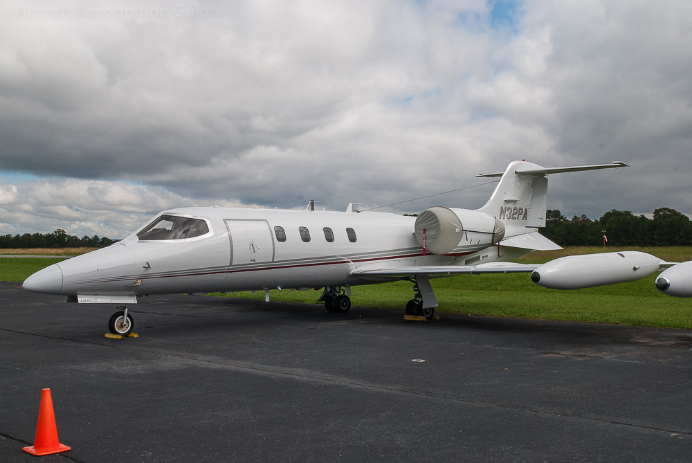 This Learjet 35A has two modifications: Avcon delta fins under the rear fuselage and a Raisbeck aft fuselage locker in between. The latter is not clearly visible here. Image