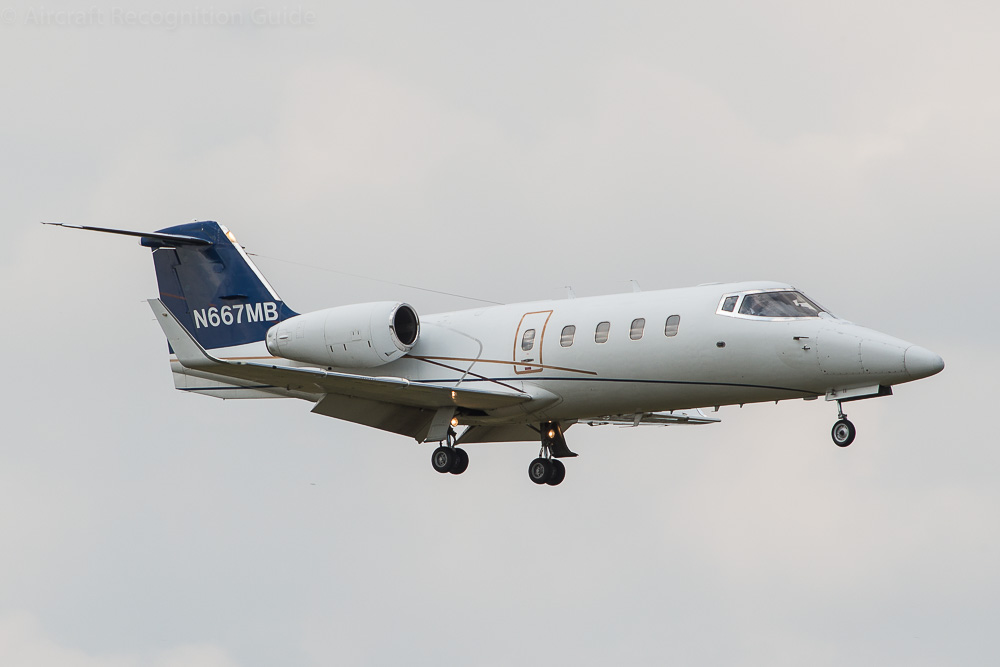 The larger diameter fuselage of the Learjet 55 is clearly visible, as is the single ventral fin underneath the tail. Image